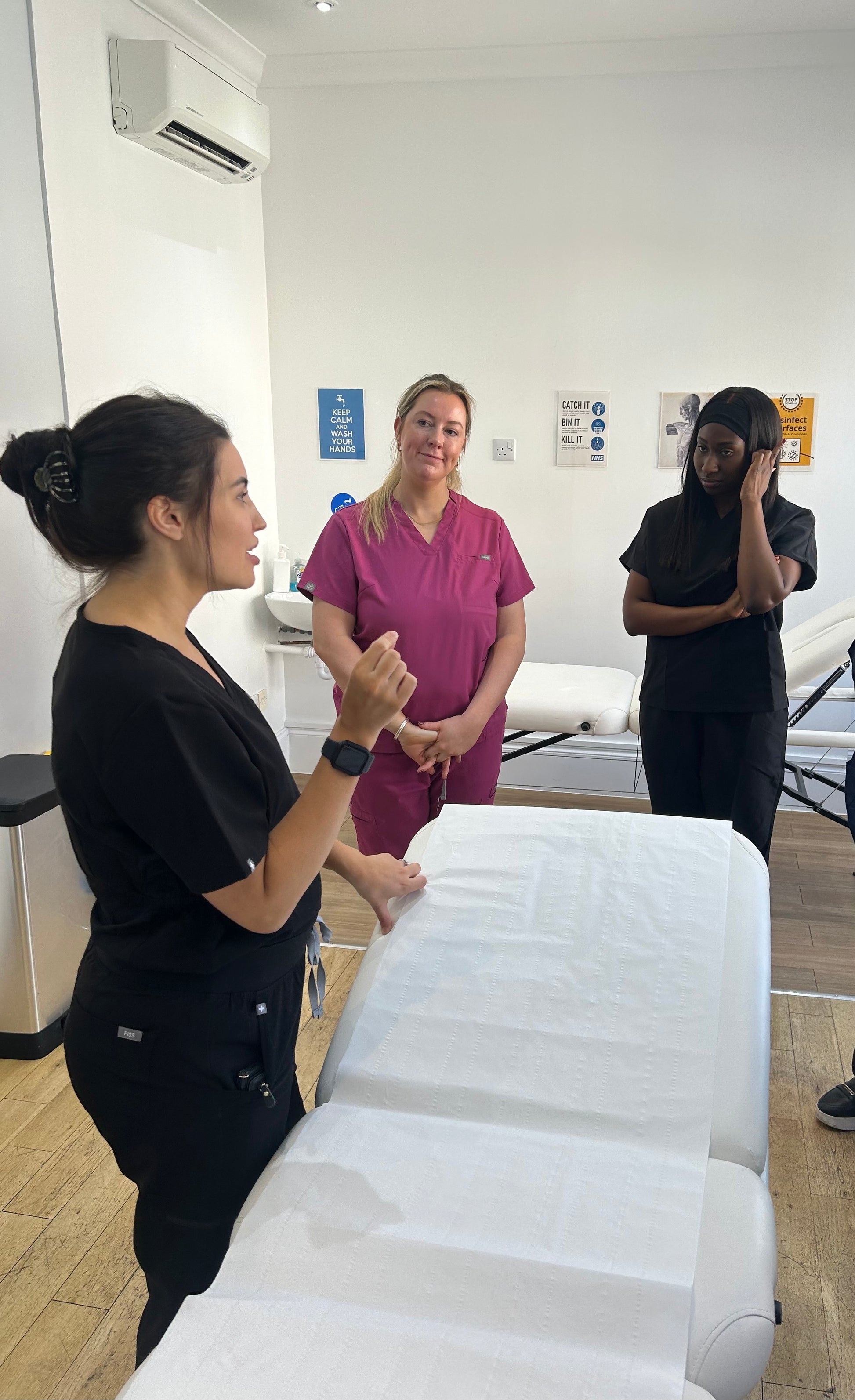 Group of aspiring aesthetics practitioners attending a fast-track course for medics and non-medics