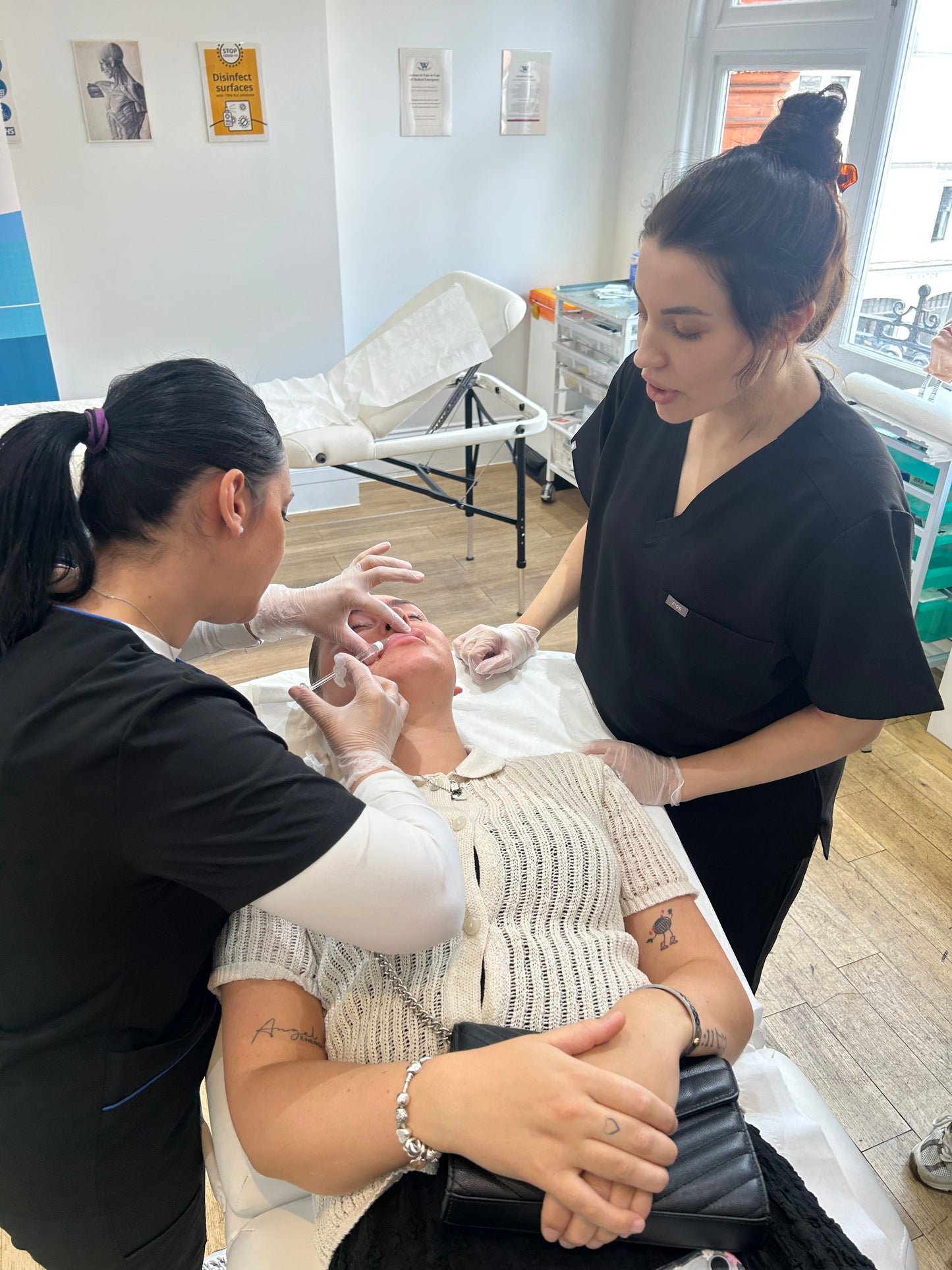Instructor demonstrating anti-wrinkle injection techniques on a live model